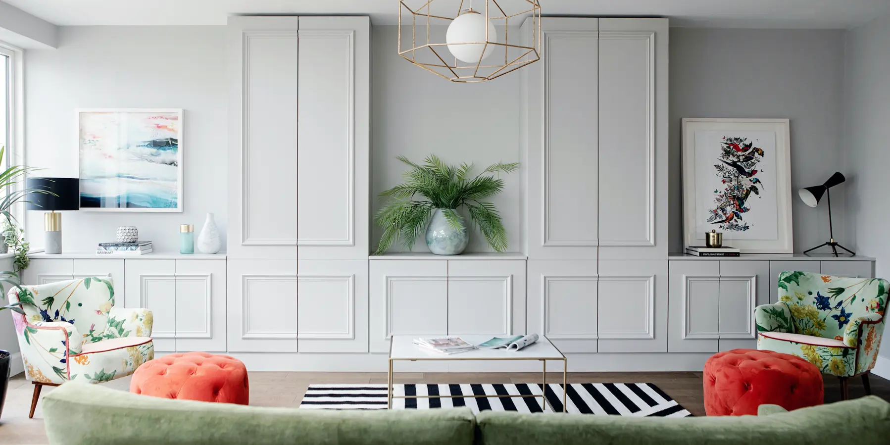 A georgian living room with brightly coloured furniture and accessories